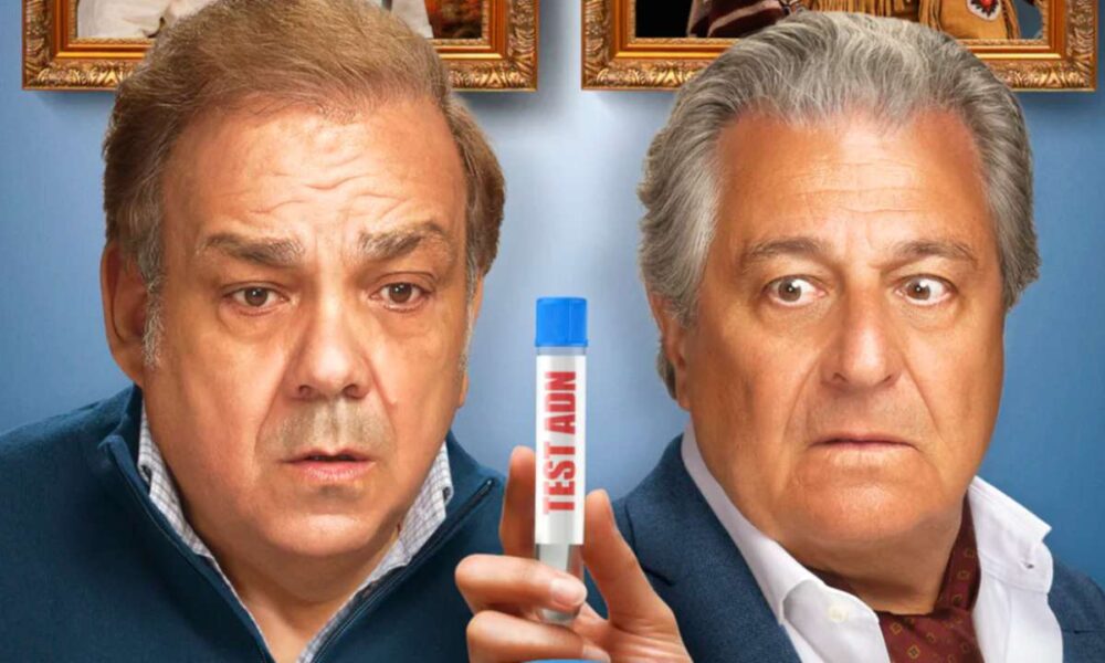 Christian Clavier et Didier Bourdon tenant un test ADN dans Cocorico 2