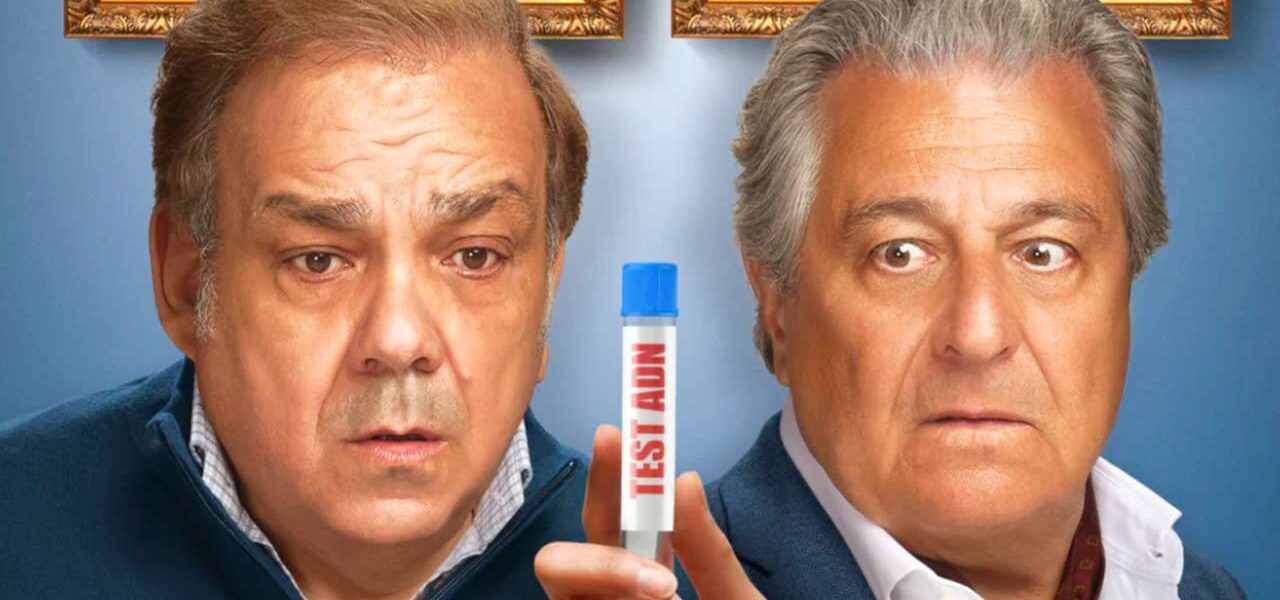 Christian Clavier et Didier Bourdon tenant un test ADN dans Cocorico 2